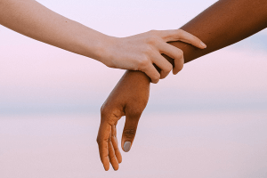 Two people holding hands