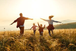 Family running through a field