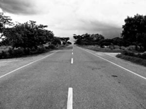 A bleak road in black and white